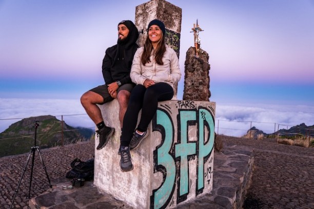 a person sitting on a rock