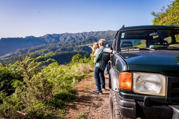 a car parked on the side of a mountain