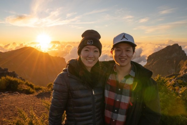 a man standing in front of a mountain