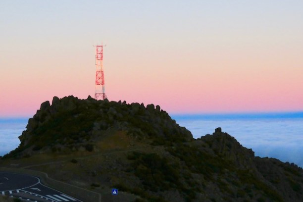 a body of water with a mountain in the background
