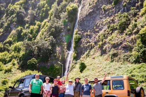 a group of people standing on top of a mountain