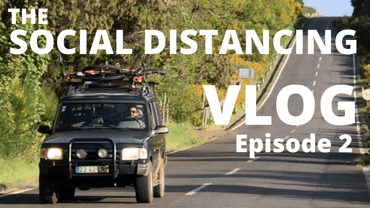 a car that has a sign on the side of a road