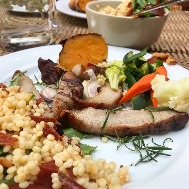 a plate of food with rice meat and vegetables