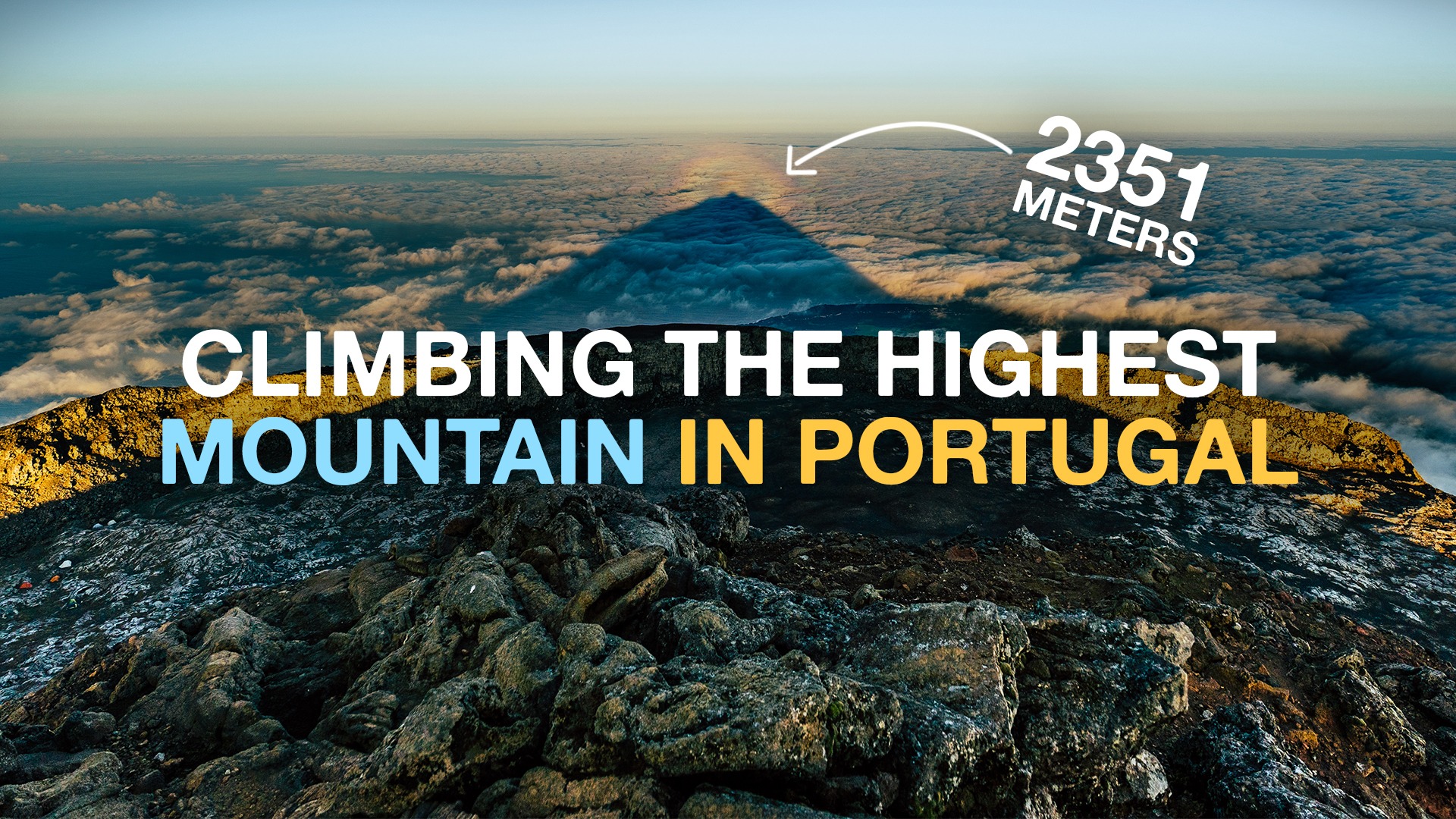 a sign on a rocky beach