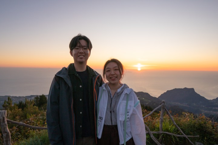 Couple enjoying sunrise together in Madeira